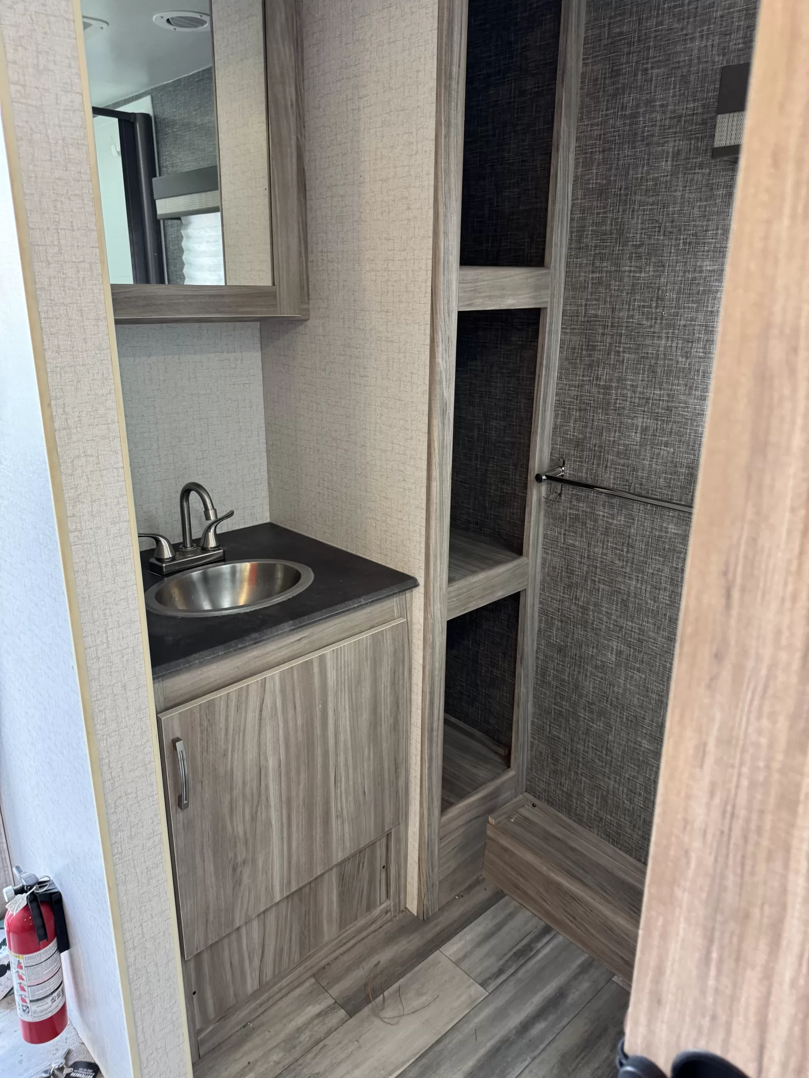2022 Winnebago Minnie 2327TB travel trailer interior cabinetry at Bell Camper Sales in Bartlesville, Oklahoma