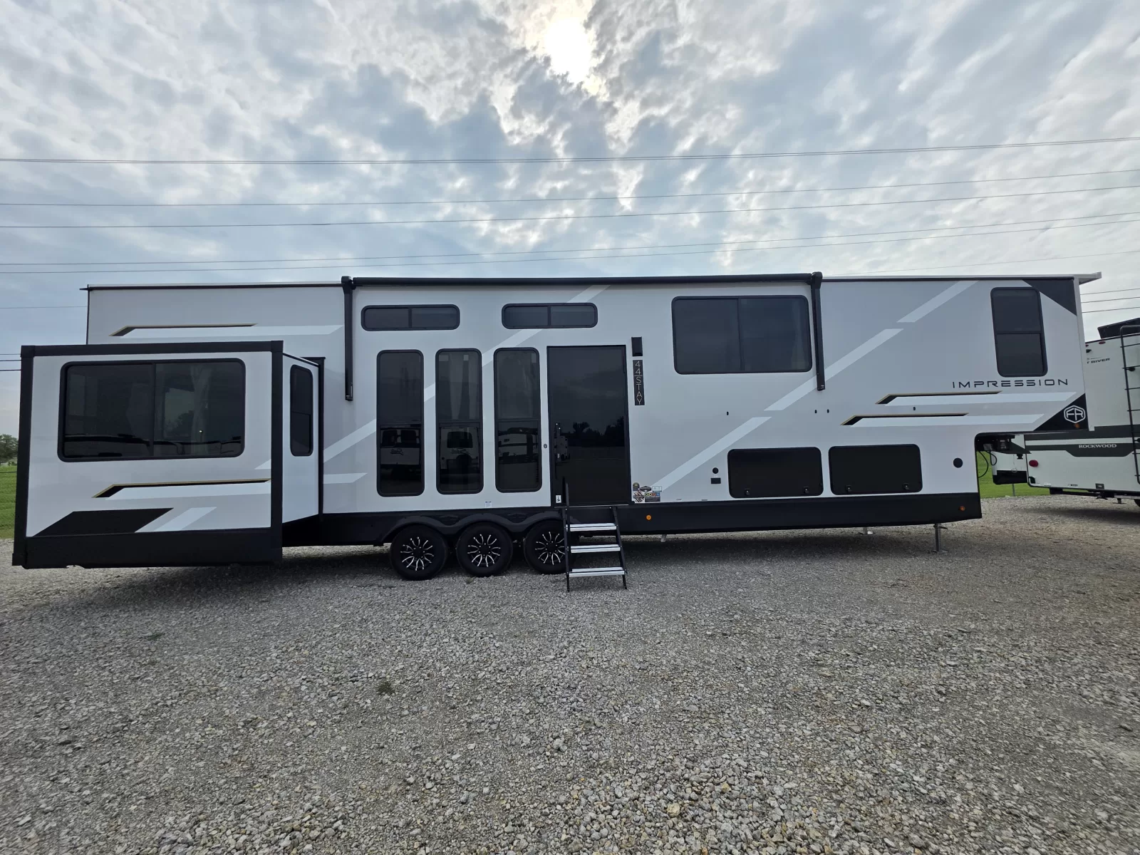 2027 Forest River Impression fifth wheel kitchen and dining area available at Bell Camper Sales in Bartlesville, Oklahoma