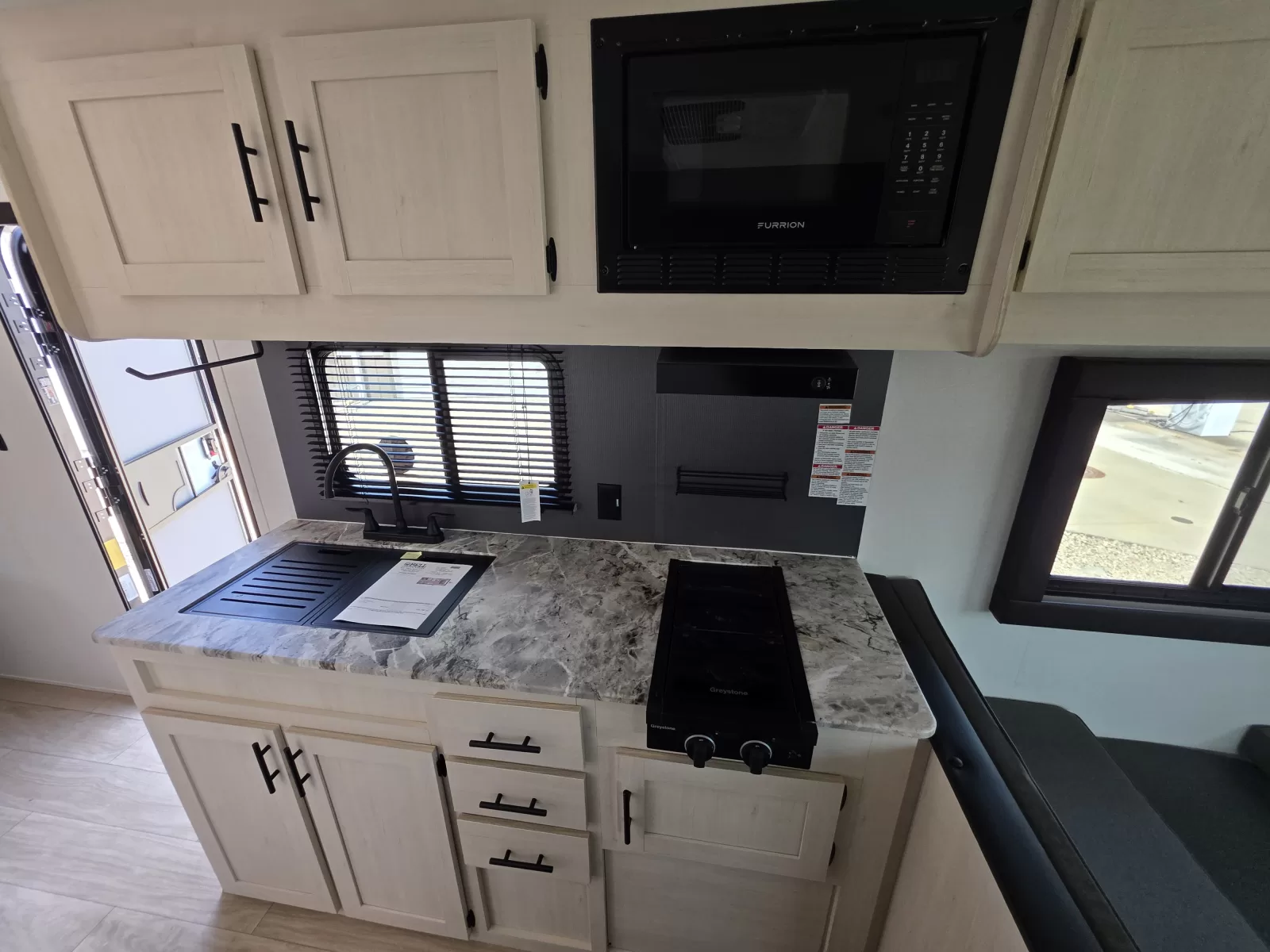 2027 Shasta Oasis 521CK travel trailer slideout view available at Bell Camper Sales in Bartlesville, Oklahoma