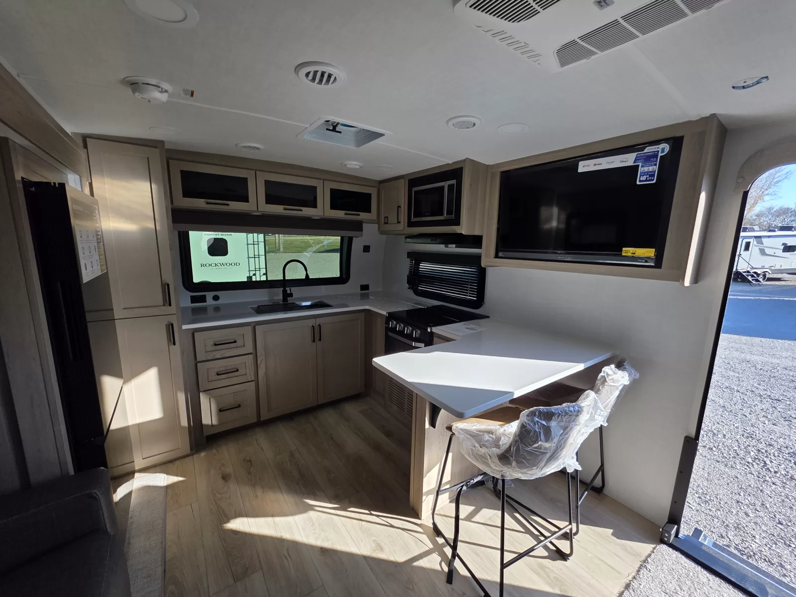 2027 Rockwood Mini Lite 2523MBR travel trailer exterior angle available at Bell Camper Sales in Bartlesville, Oklahoma