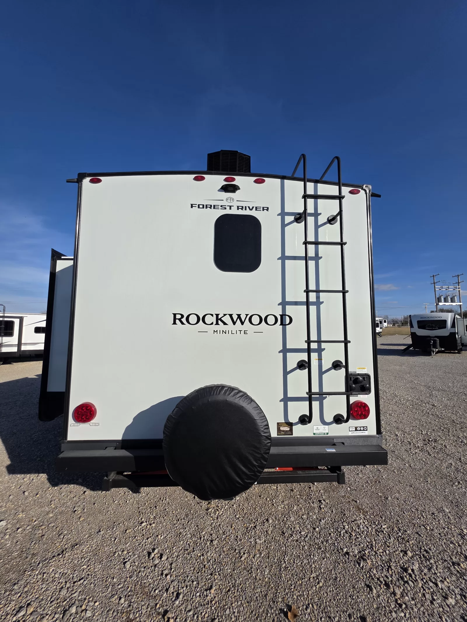 2027 Rockwood Mini Lite 2523MBR travel trailer kitchen and dining area at Bell Camper Sales in Bartlesville, Oklahoma