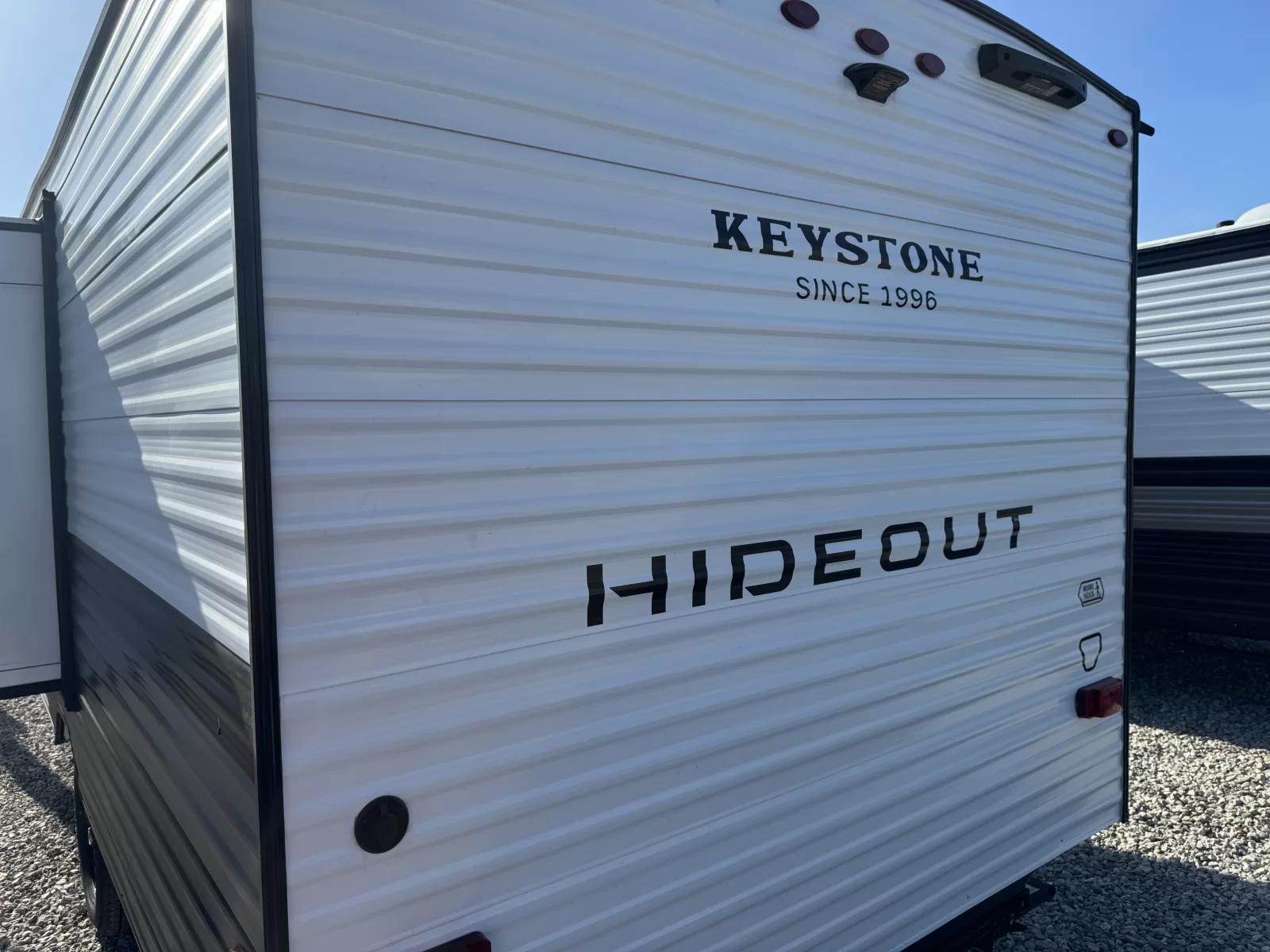 2027 Keystone 199BHS travel trailer side exterior available at Bell Camper Sales in Bartlesville, Oklahoma